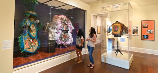 Two women browse the exhibits at The Presbytère in New Orleans.