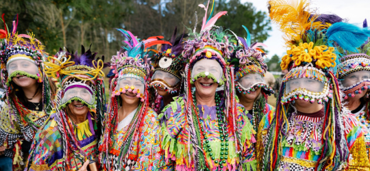 A group photo of women dressed up for Courir de Mardi Gras. 