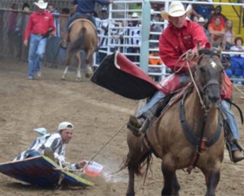 Two people perform at the Angola Prison Spring Rodeo.