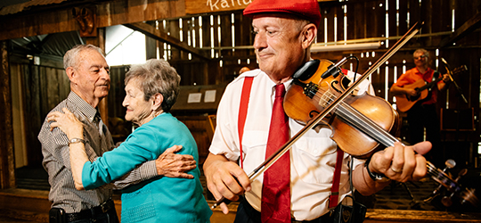 A couple dances to Cajun music.