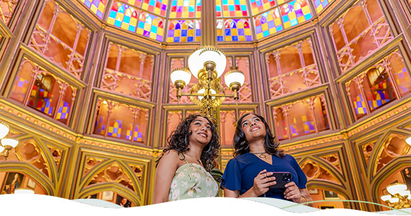 Two women look up at the stained glass ceiling at Louisiana's Old State Capitol.