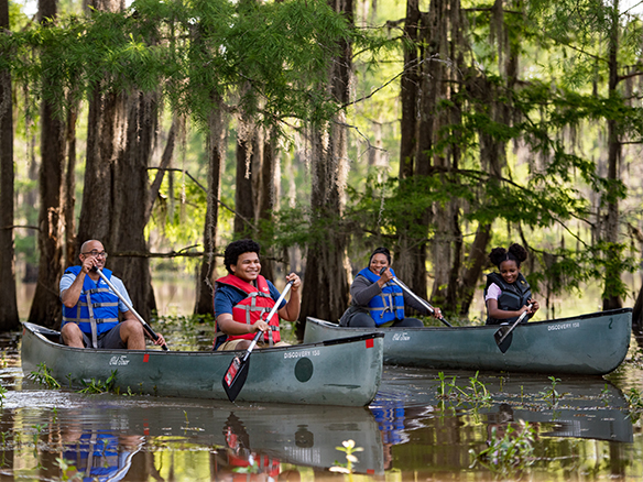 A family paddles Lake Bistineau.