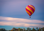 A balloon ascends.
