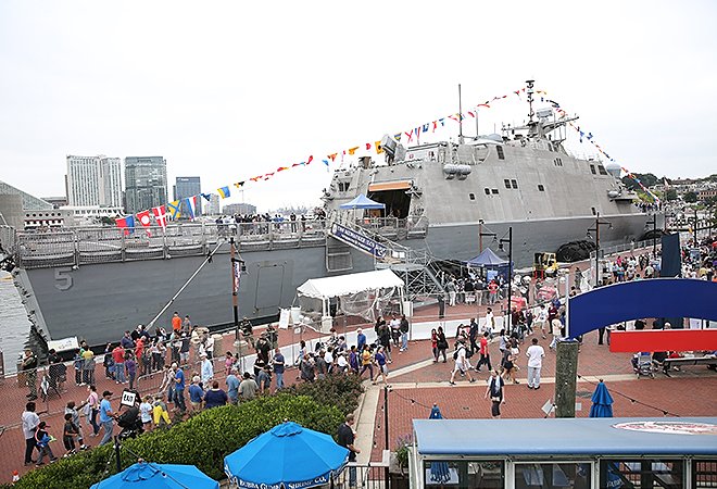 Picture of people admiring and visiting the Naval Ships in the Baltimore Inner Harbor during Fleet Week & Air Show Baltimore.