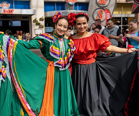 A picture of two Hispanic lady dancers.