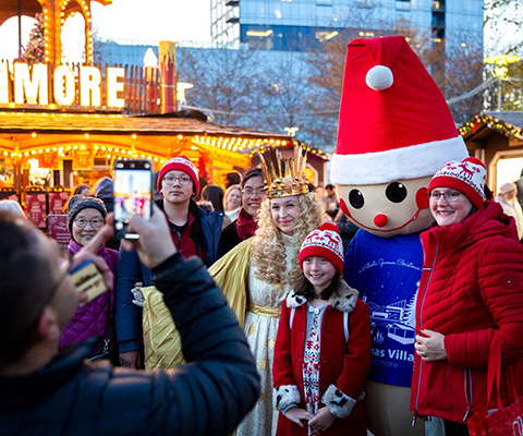 Picture of people enjoying the German Christmas Market in Baltimore.