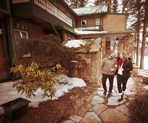 Picture of a couple walking together in the snowy winter.