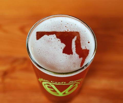 Beer with outline of the state of Maryland in the foam at top.
