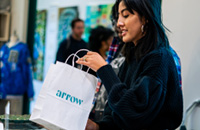 A shopper with a gift bag from Arrow Creative