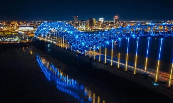 A rotating display of images from the city of Memphis, including an illuminated bridge over the Mississippi River, a scene from inside the National Civil Rights Museum and a visitor experiencing Elvis Presley's Graceland.  
