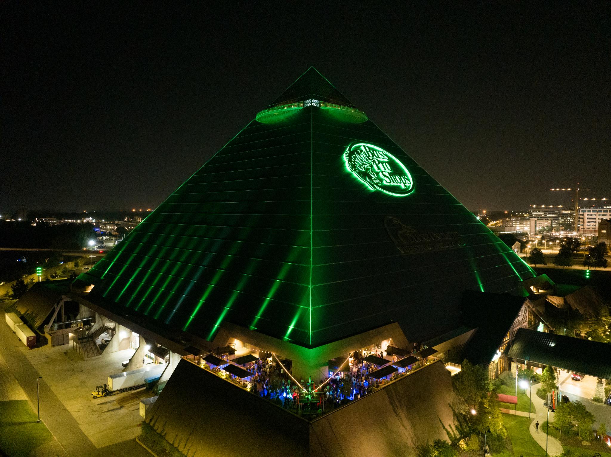 A nighttime image of the pyramid-shaped Bass Pro Shops in Memphis, Tennessee