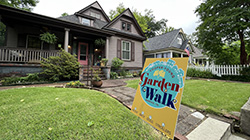 A home with a Cooper Young Garden Walk sign in the front yard. 