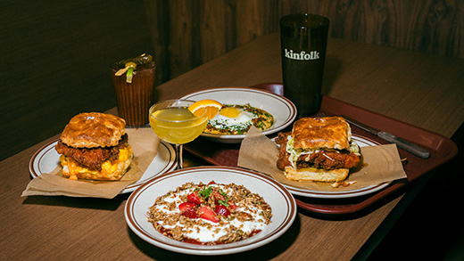 Breakfast plates with oatmeal, egg scrambles and chicken biscuits, a mimosa and a bloody mary from Kinfolk.
