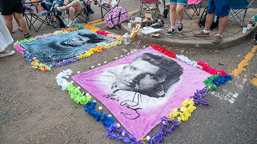 Two fabric portraits of Elvis with lei borders around them crafted by Elvis fans at Elvis Week. 