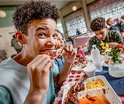 Kids eating ribs at Paynes BBQ