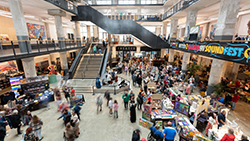 A shot from the second floor of Crosstown Concourse, showcasing the Crafts and Draft Holiday Market filled with shoppers.