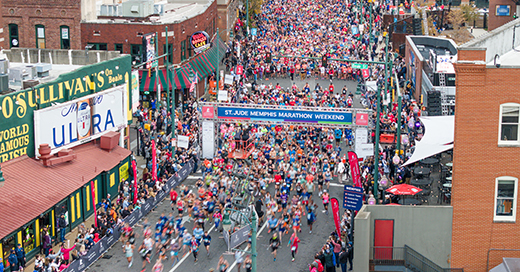 Aerial shot of runners on Beale Street during the St. Jude Memphis Marathon.