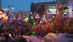 Santa riding his sleigh down Beale Street at the annual Beale Street Holiday Parade.