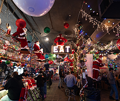 The interior of local favorite Young Avenue Deli decorated in extravagant Christmas decor.
