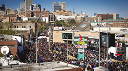A crowd gathered outside the National Civil Rights Museum with a stage outside the entrance. 