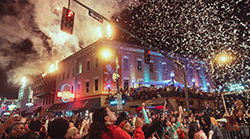 A crowd watching confetti fall from the sky during the New Year's Eve celebration on Beale Street.