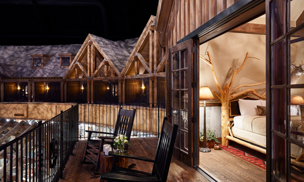 Porch of a guest room with two rocking chairs on it at Big Cypress Lodge.