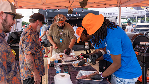 A team preparing barbecue at the World Championship Barbecue Cooking Contest.