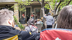 Folks watching a performance at Cooper-Young Porchfest.
