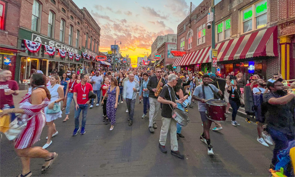 Conference of people march down Beale Street during the day