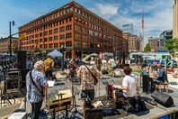 Live music being played outside in downtown Grand Rapids during a festival. 