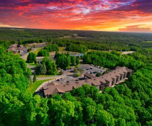 Condos beside a forest and golf course. 