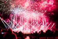 An audience watching a fireworks display.
