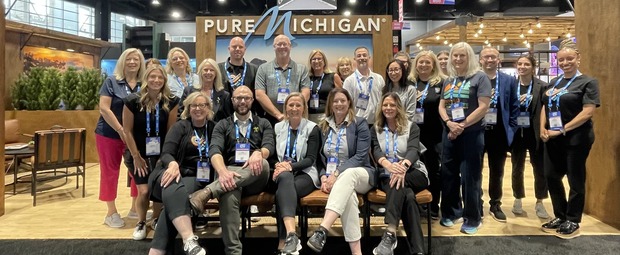 Travel Michigan and destination representatives in the Pure Michigan booth at IPW. 