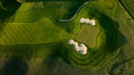 A golf course with sand traps. 