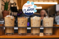 An iced latte flight below a logo for Flights of Flavor.