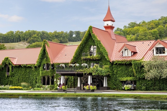 The exterior of The Highlands covered in ivy.