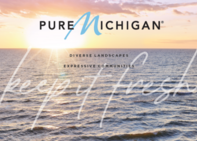 The Pure Michigan Logo over an image of a sunset on Lake Superior. 
