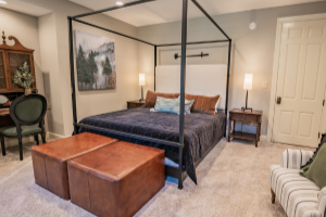 A four post bed in a modern room at a bed and breakfast. 