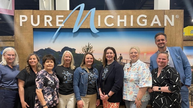 A team of Michigan tourism professionals at the Pure Michigan booth during IPW 2026. 