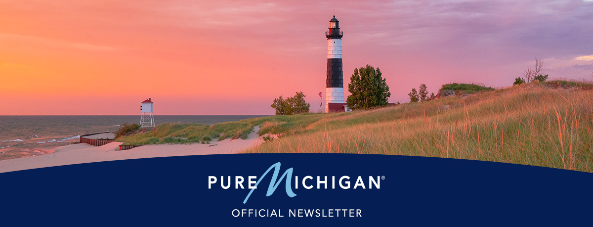 A lighthouse on the shore at sunset with overlaying text that reads "Official Newsletter" and the Pure Michigan logo. 