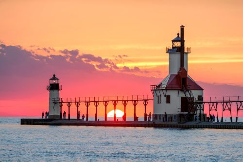 Saint Joseph Lighthouse on Lake Michigan at sunset. 