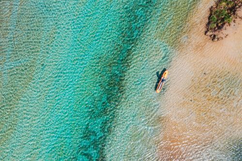 A paddleboarder on Torch River in the northwest Lower Peninsula. 