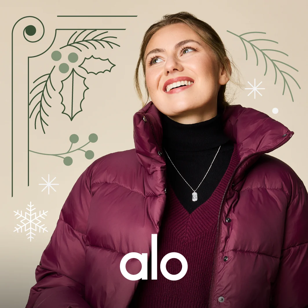 a woman wearing a burgandy/maroon puffer jacket from Alo