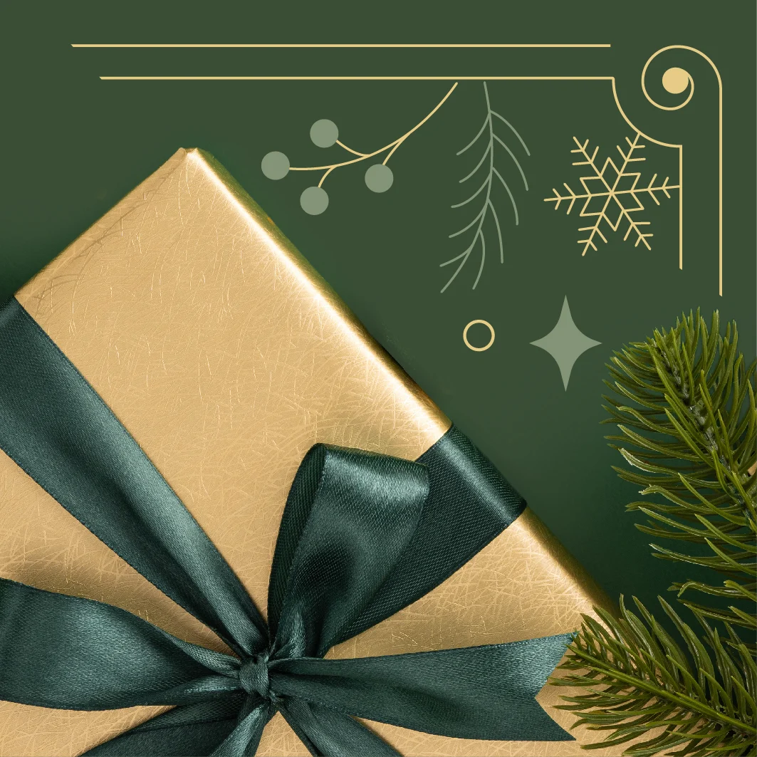 a golden gift wrapped in a green bow