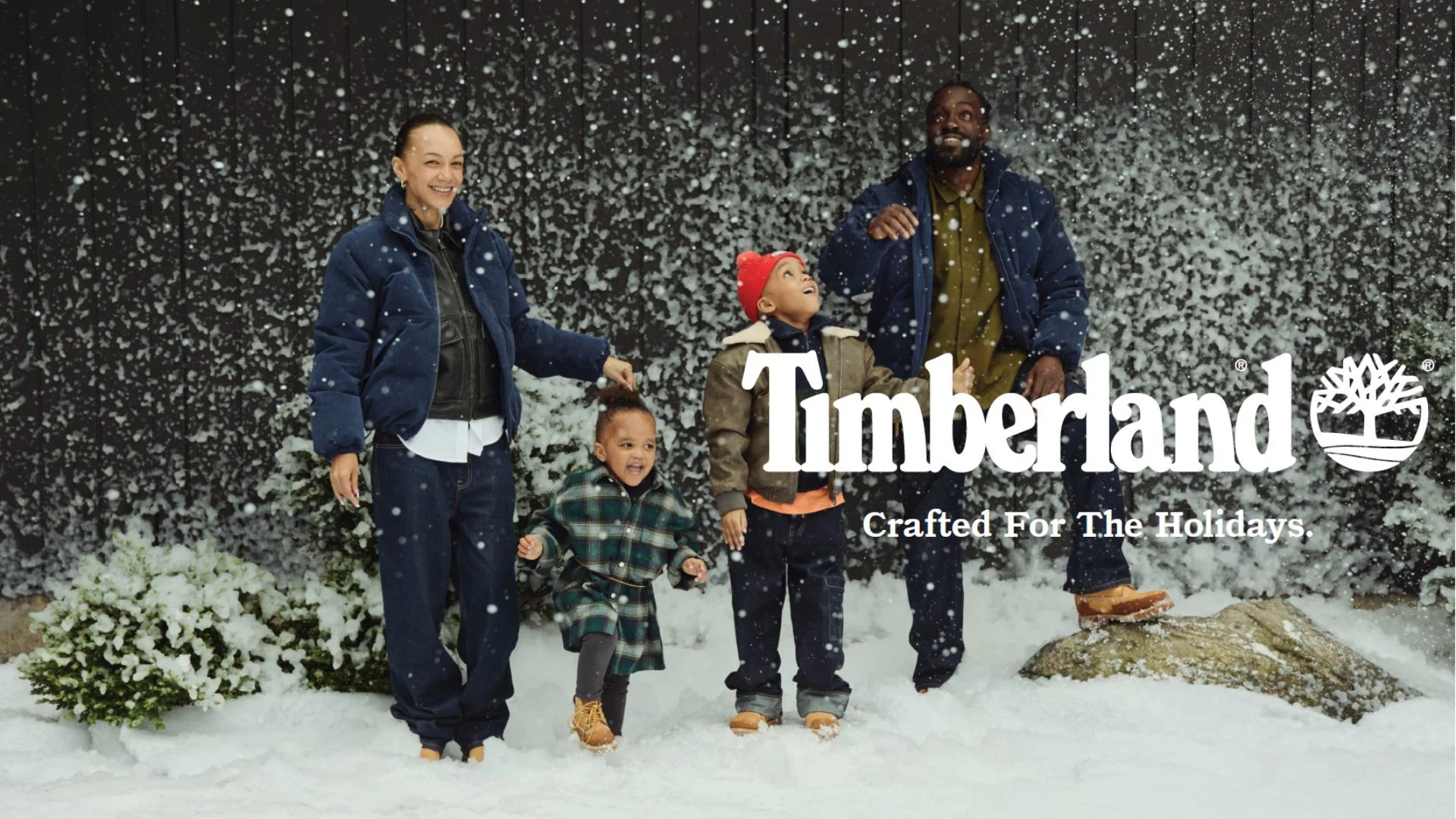 FAMILY IN FRONT OF SNOW