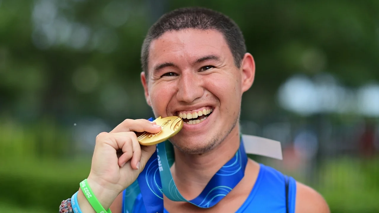 a person biting a metal