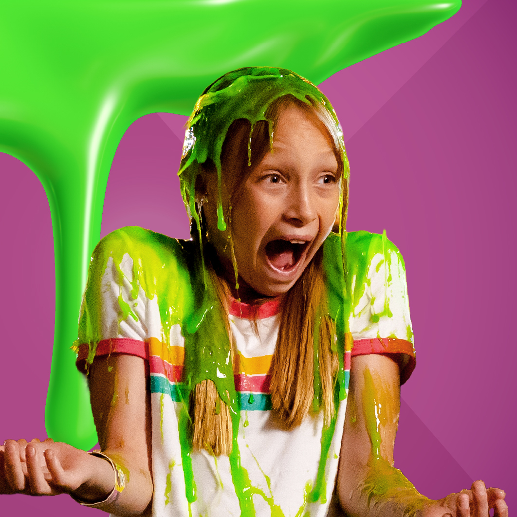 a young person getting slimed at the nickelodeon universe slime chair