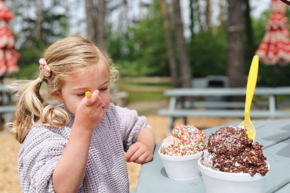 a little girl eating ice cream