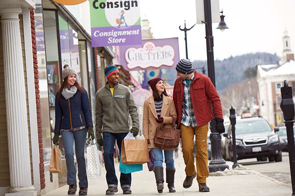 a group of people shopping on a main street