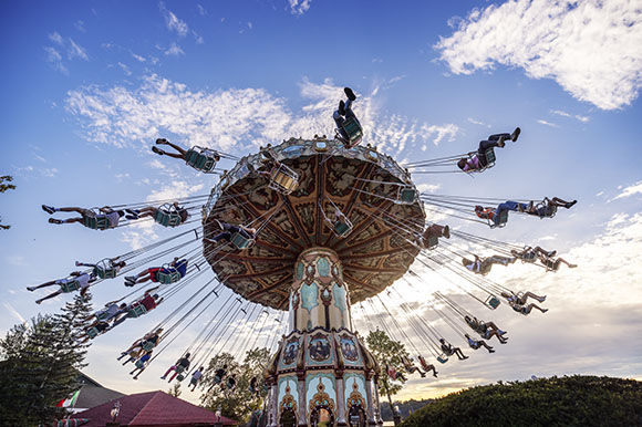 a carnival ride with swings in the air